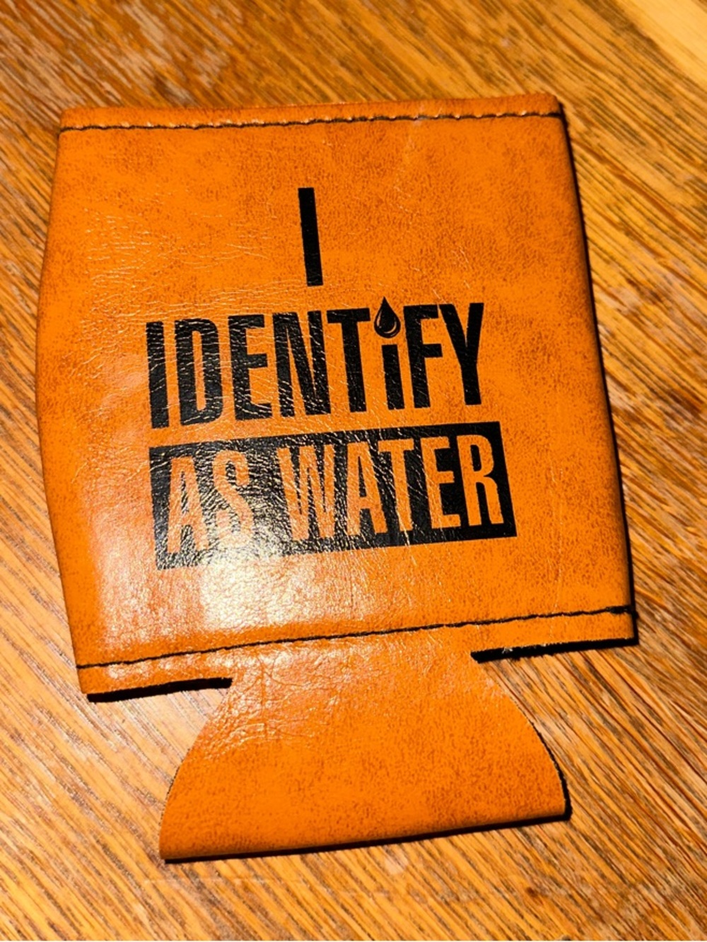 Pleather coozie: 'I Identify As Water' Text
